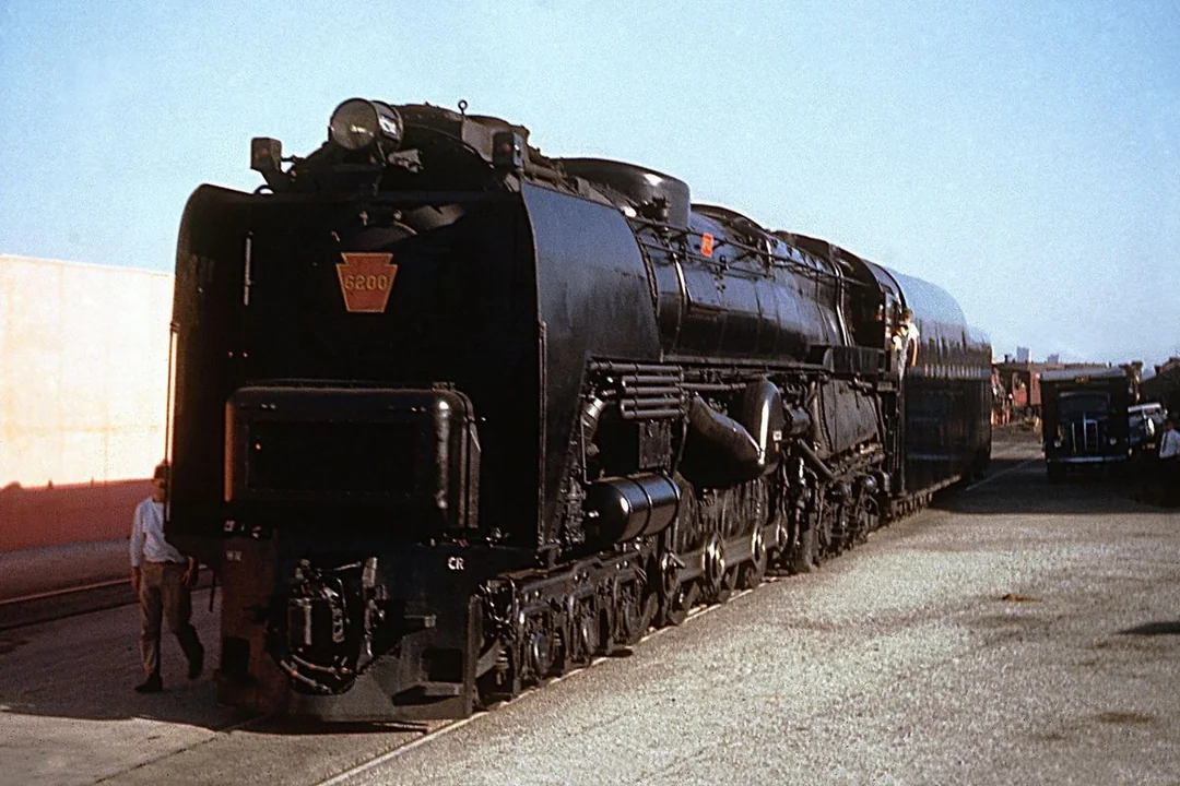 How Did Steam Locomotives Lower The Cost Of Transporting Raw Materials And Finished Goods?